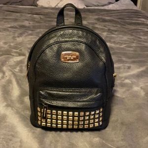 Michael Kors black leather studded backpack.